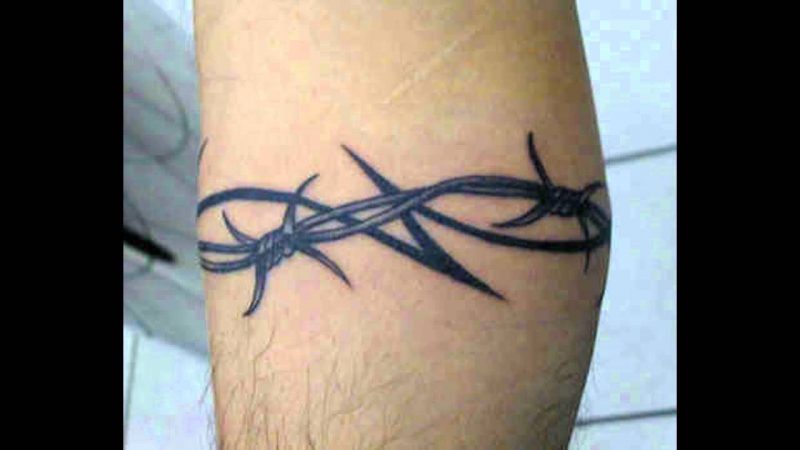 Bicep Barbed Wire tattoo over 40