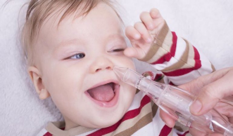 How do you use a nasal aspirator on a baby?